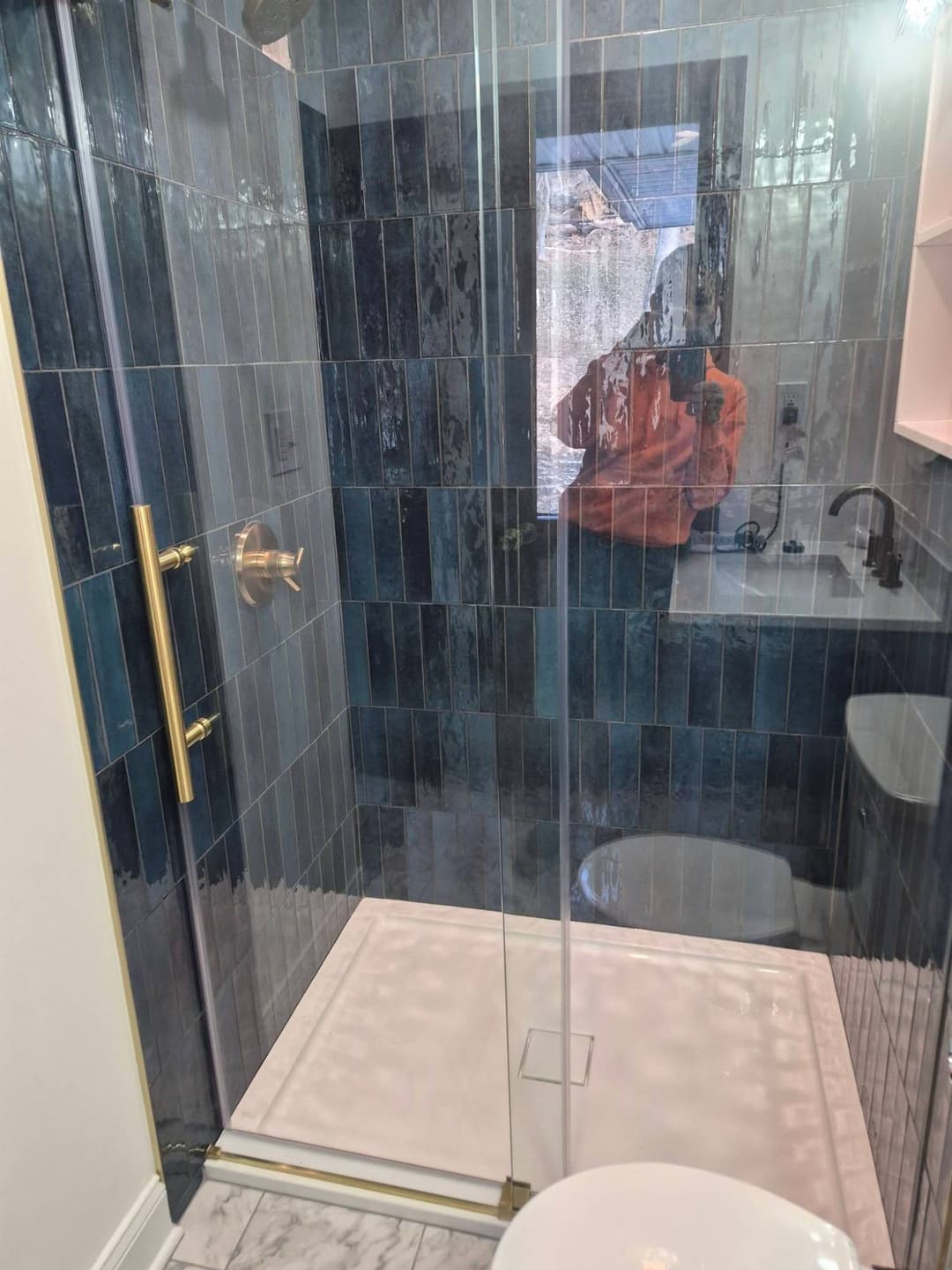 Custom Blue Tile Shower with Brass Fixtures